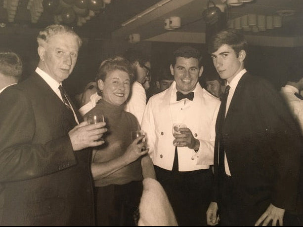 Black and white photo of a group of Robert and his Parents.