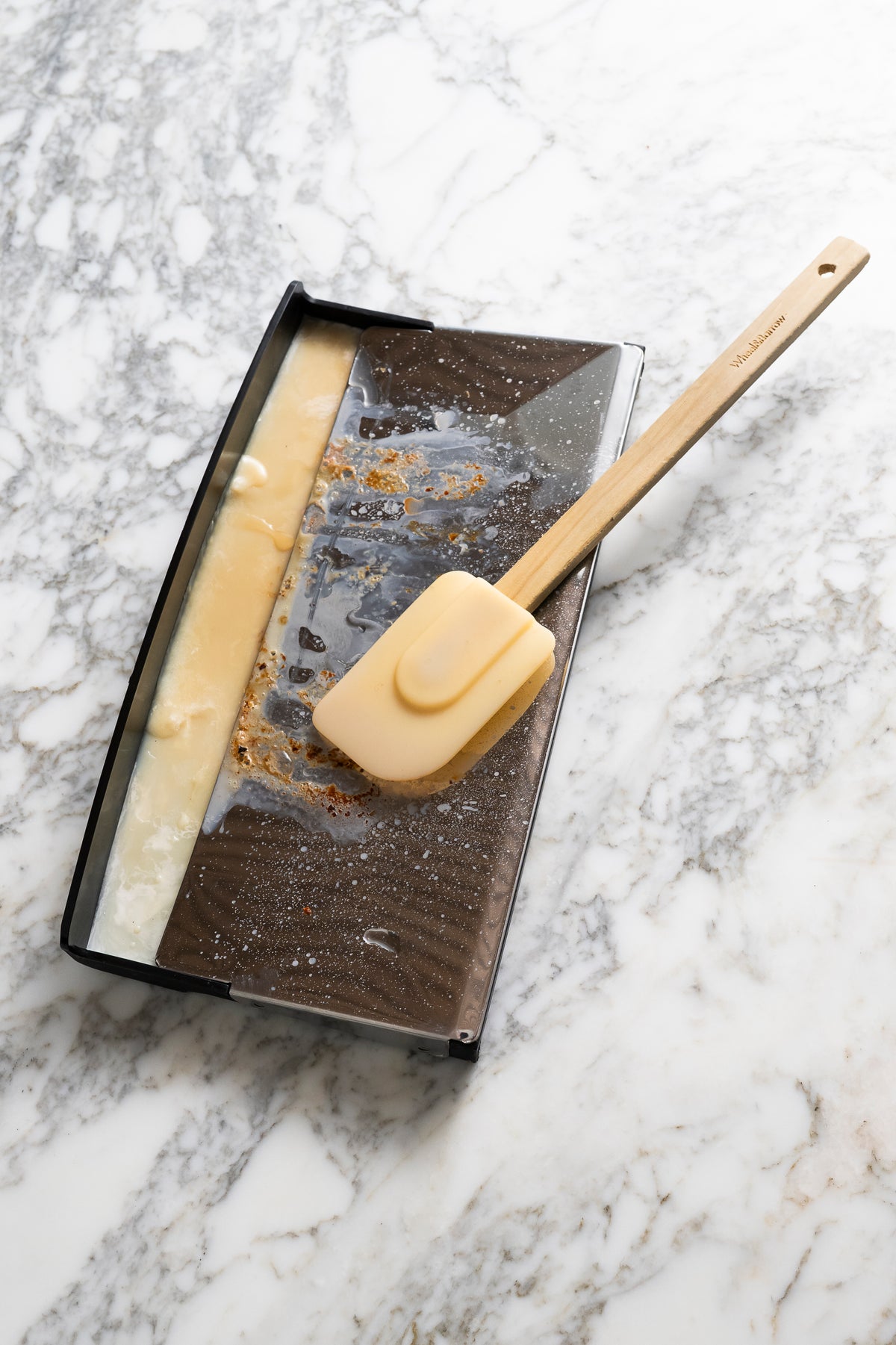VGrill drip tray with collected oils and fats for healthier cooking and easy cleaning